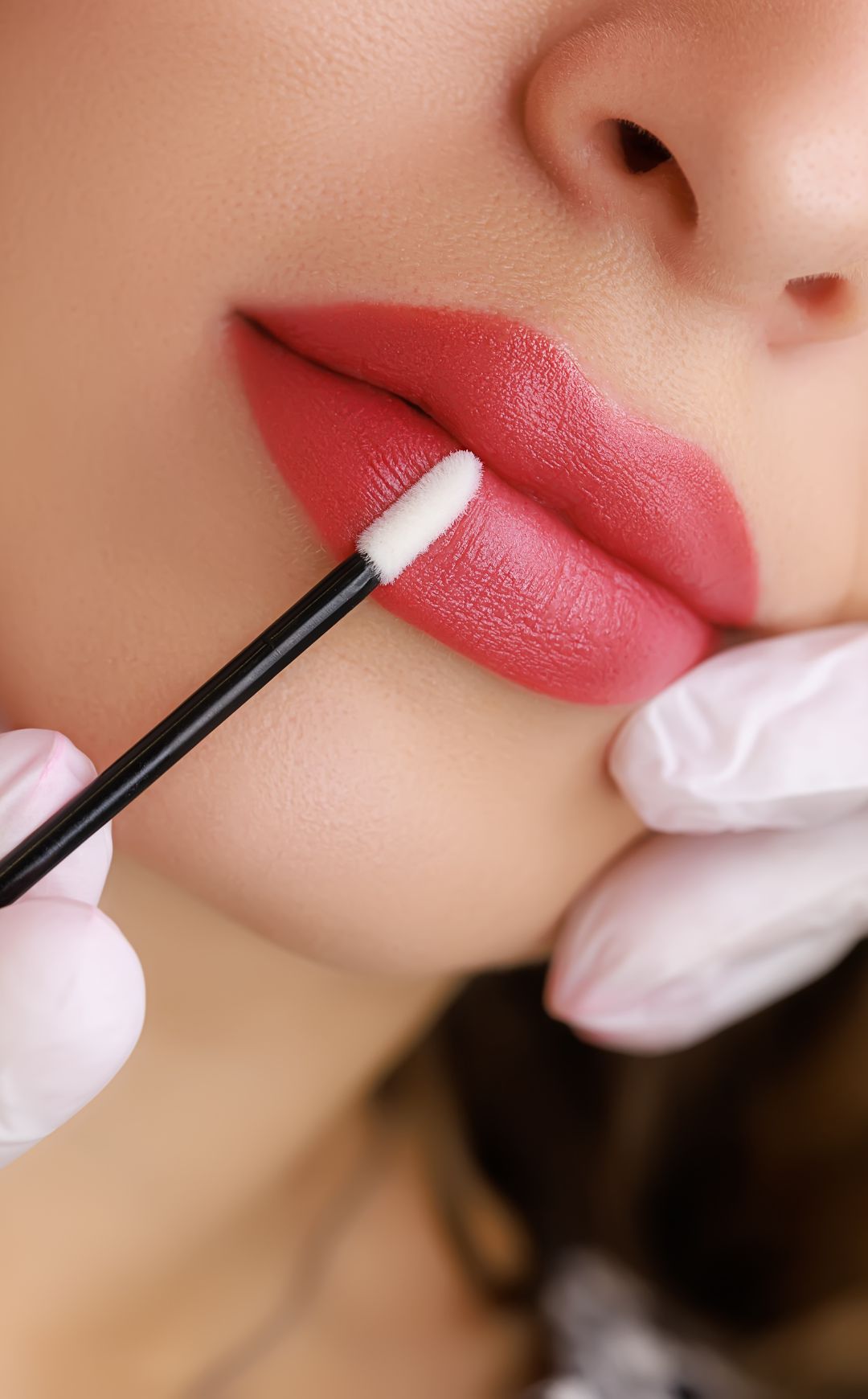Client receiving permanent makeup treatment